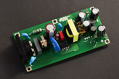 A switched-mode power supply board used in an adapter