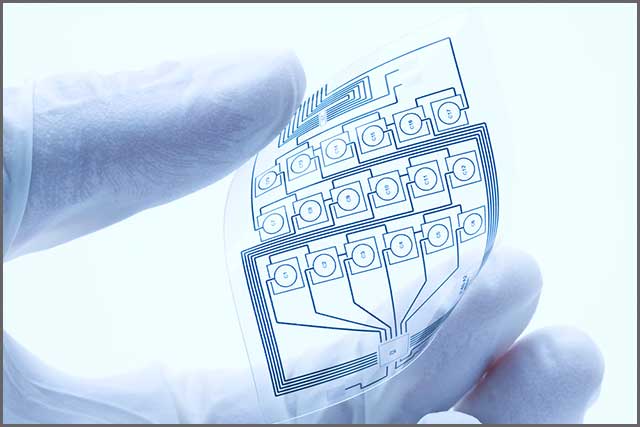 A flexible printed circuit board held by a human hand