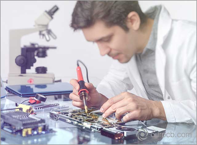 PCB soldering. Bits sticking to the surface of the board cause solder balling