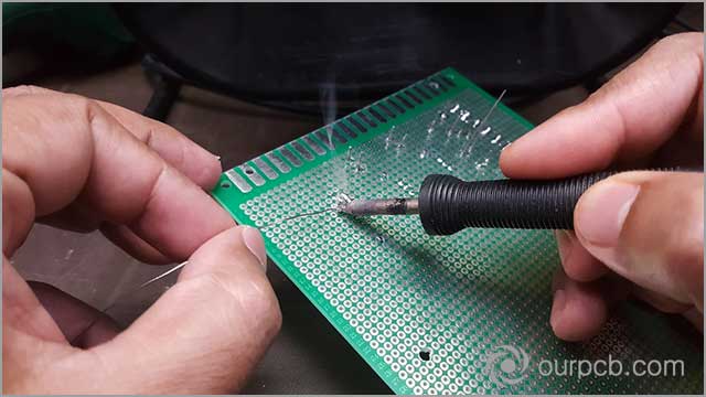 PCB soldering in progress. Ensure pads are even before soldering