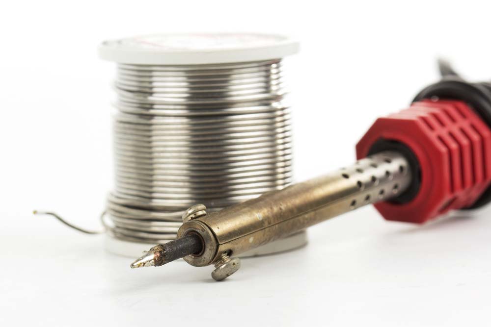 Solder wire next to a soldering iron