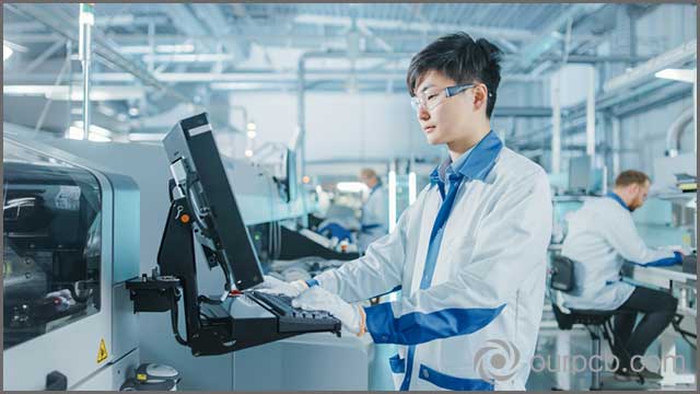 A technician working on the production of advanced circuit boards