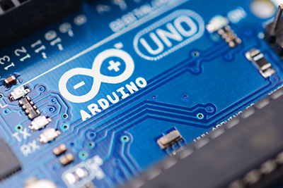 It illustrates a close-up of Arduino circuit board