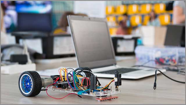 It shows the prototyping of a robotic car using Arduino circuit board