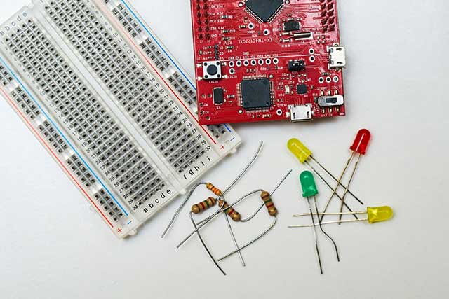 The microcontroller comes with a small pile of LED lights and resistors