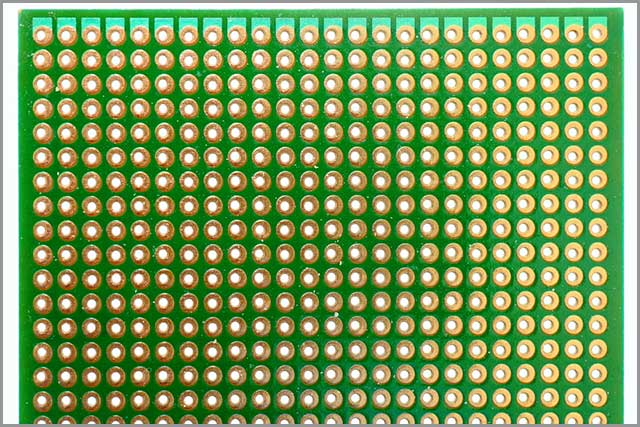 A typical blank green PCB board