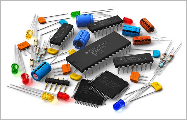 Several PCB components on an isolated white background