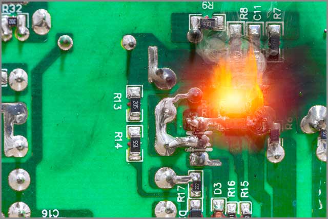 a damaged PCB resulting from a short circuit