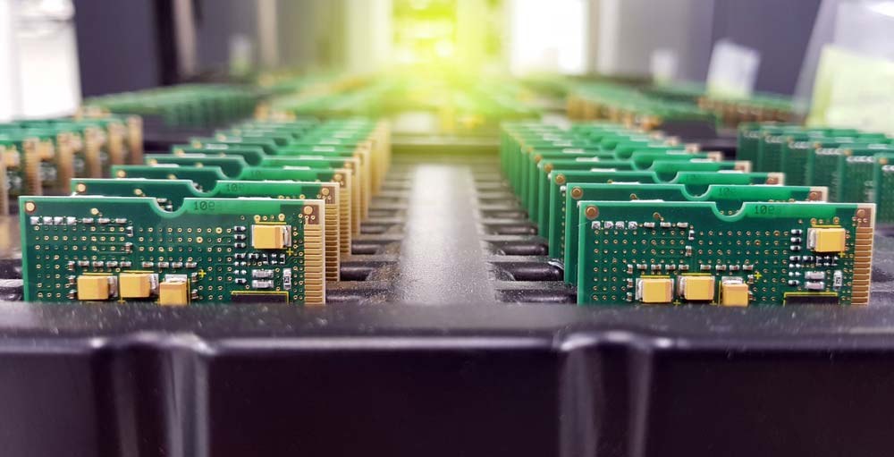 Circuit boards stored on a tray for future use