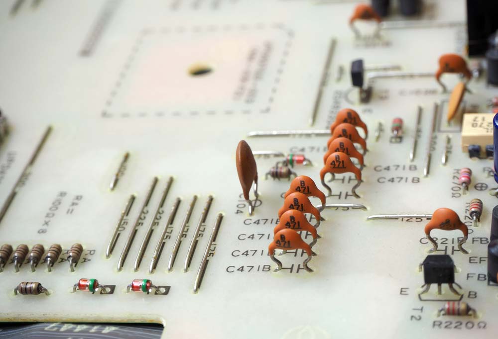 Electronic components mounted on a white PCB