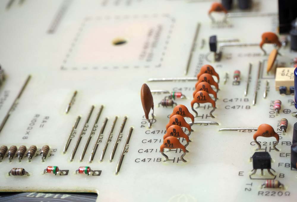 Electronic components mounted on a white PCB