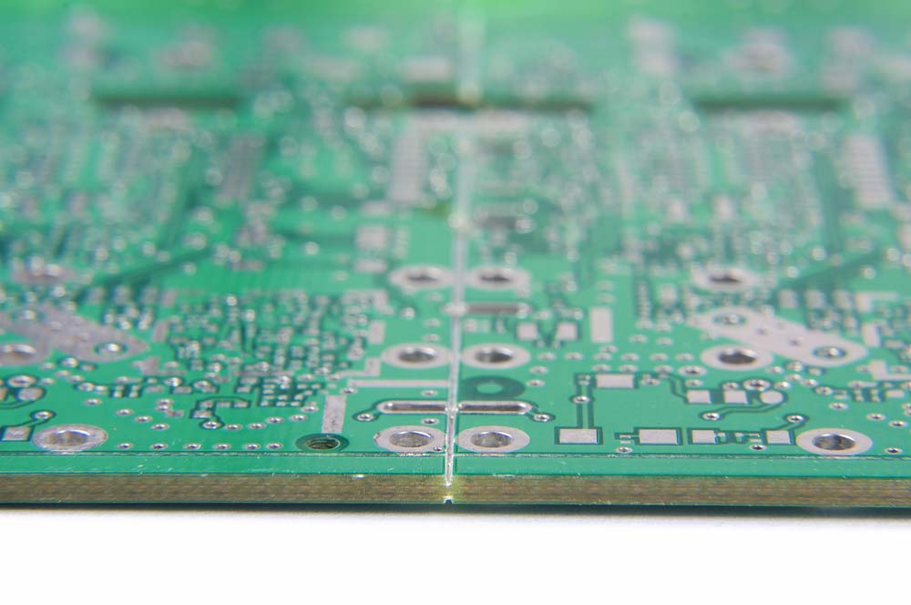A regular FR4 PCB panel with a V-scoring cut to separate the individual pieces