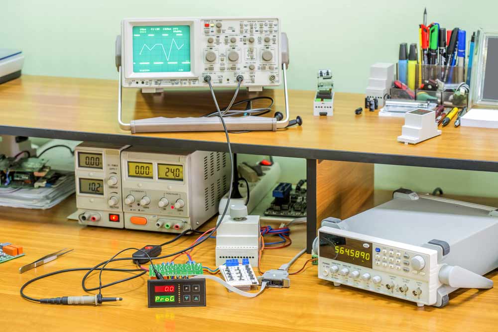 An electronics workbench with different testing equipment