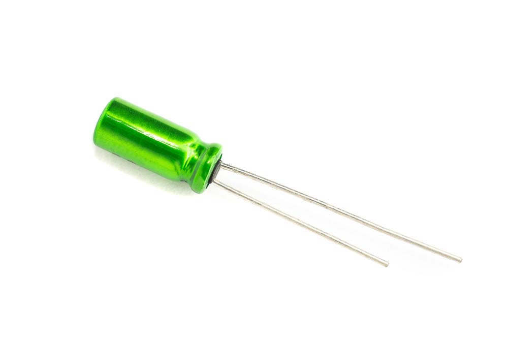 An electrolytic capacitor with a short and long pin