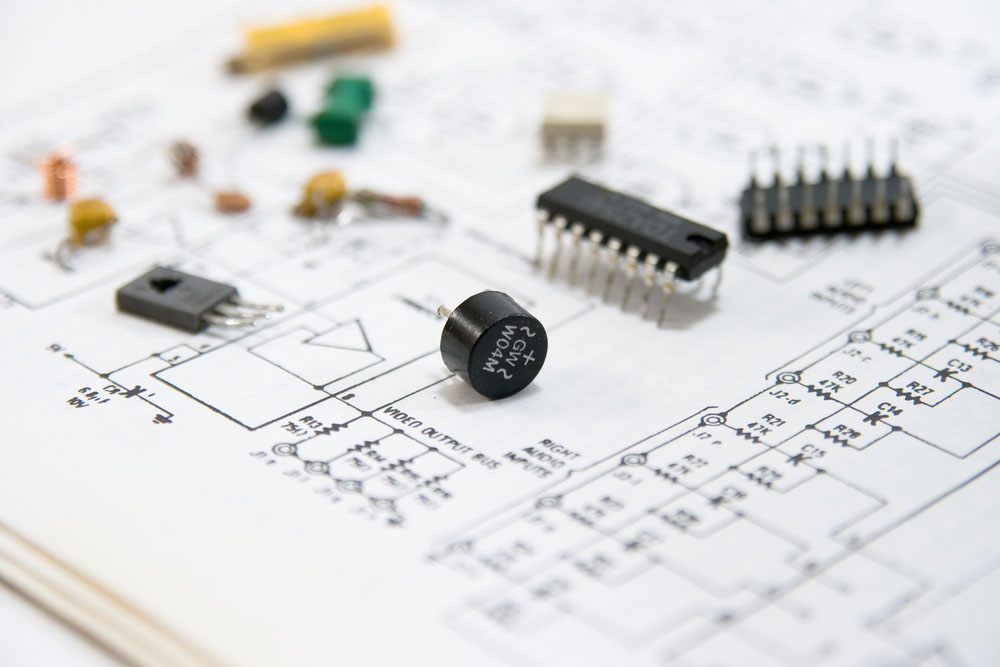 Electronic components spread out on a circuit diagram