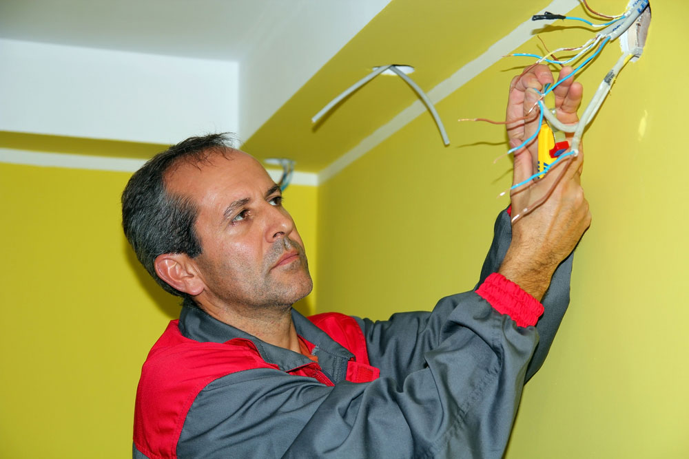 An electrician testing a connection