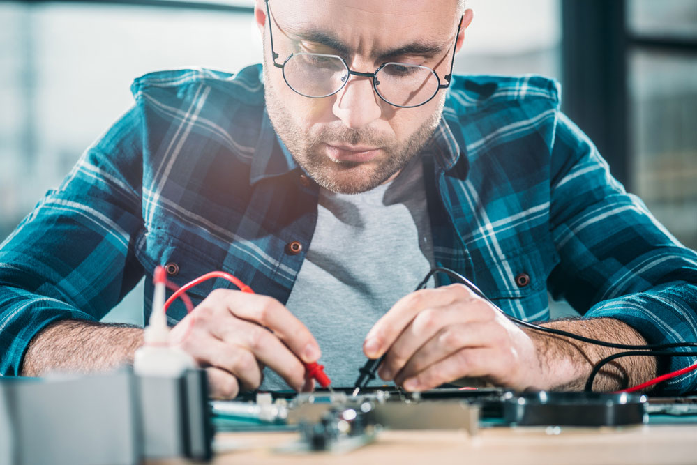 An Engineer Checking a Circuit Board