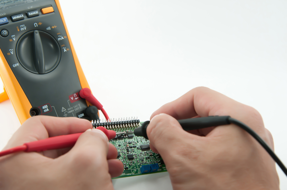 Hands-Checking Socket Voltage Using Digital Voltmeter 