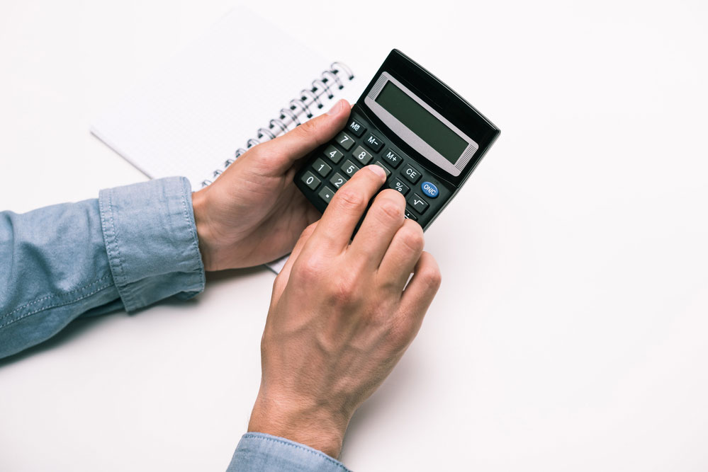 A Man Using a Calculator