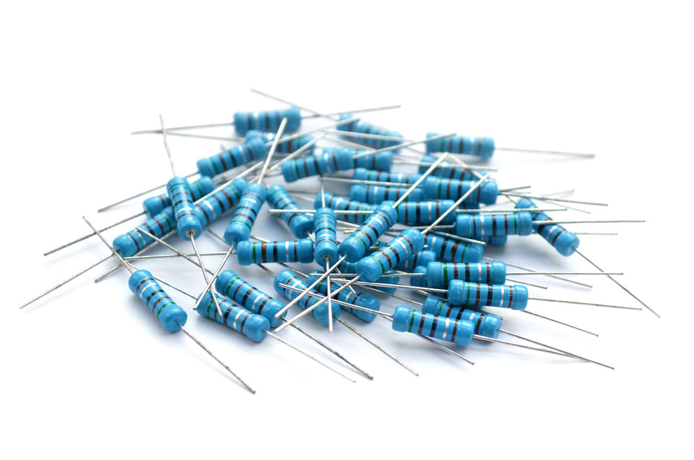 Carbon Film vs. Metal Film:Gold plated blue metal oxide resistors on green printed circuit board