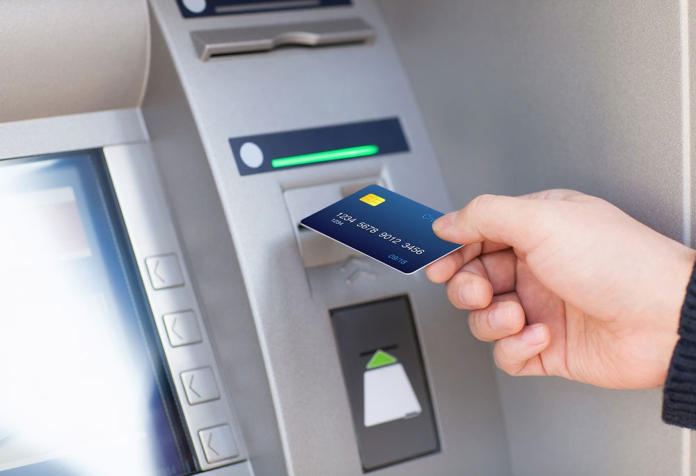 Man inserting using an ATM card