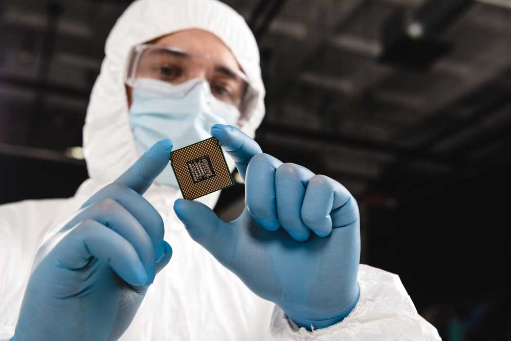 A worker holding an integrated circuit