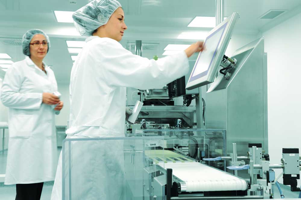 Female operators at a production line in a manufacturing plant