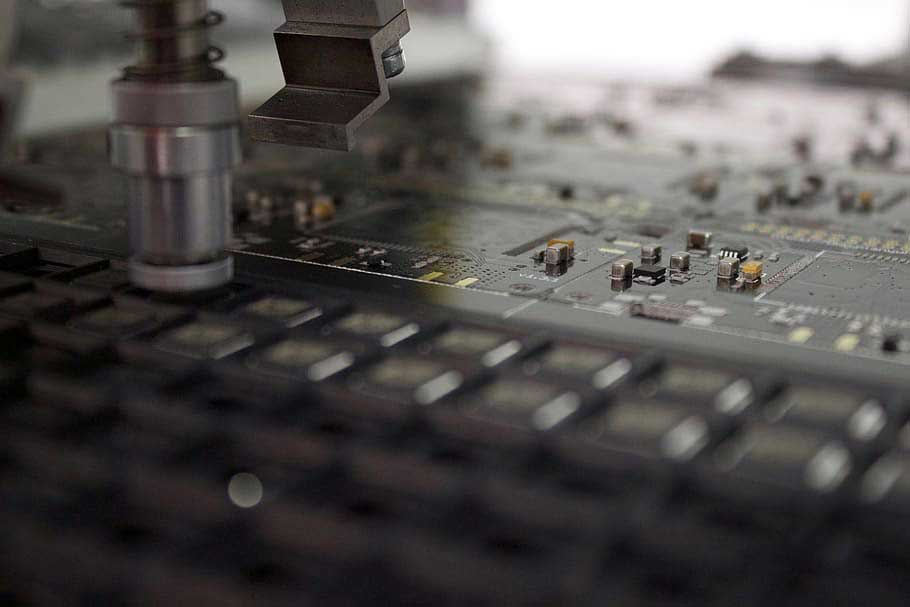 Close-up of Pick-and-place machine in a robotics factory