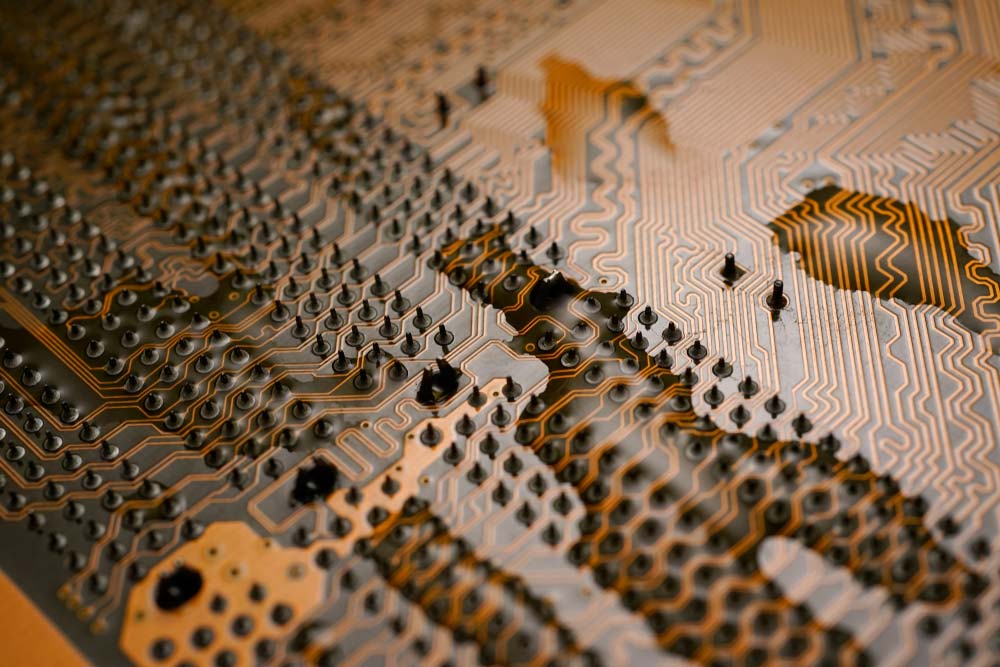 An orange waterproofed circuit board