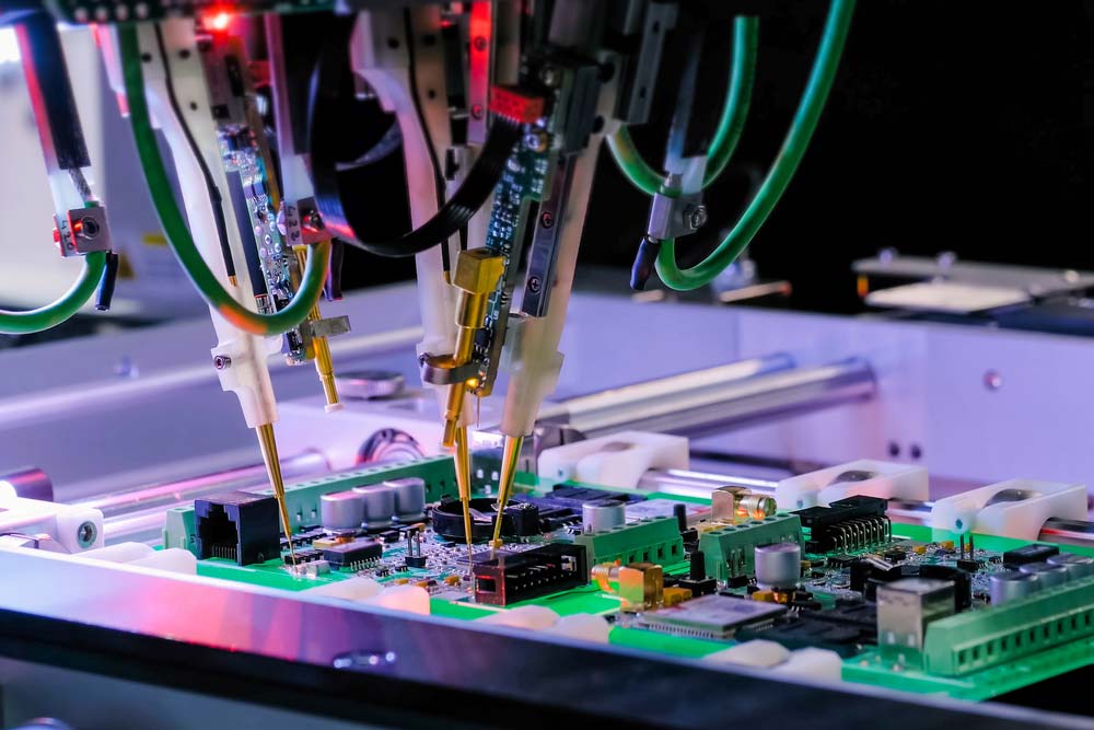 A circuit board undergoing flying probe testing