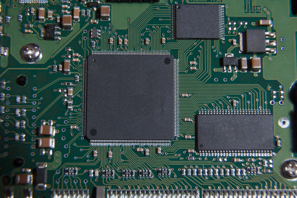 A green circuit board with some chipsets