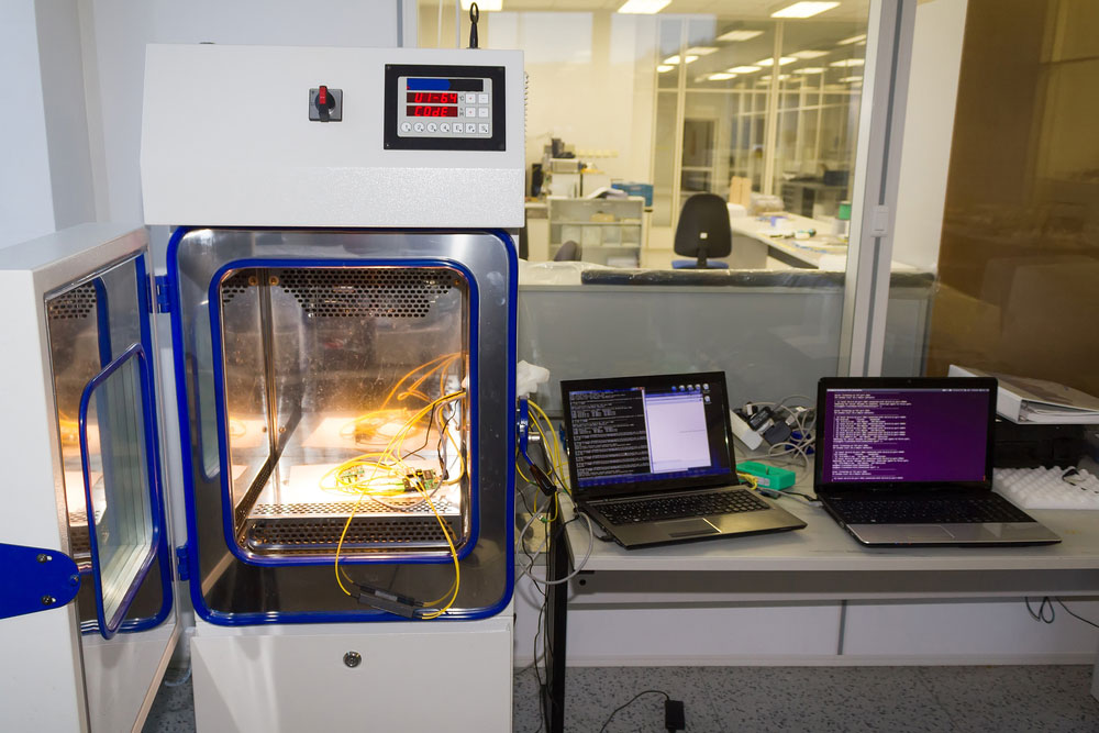 PCB-based devices being tested in an open temperature and climate test chamber 