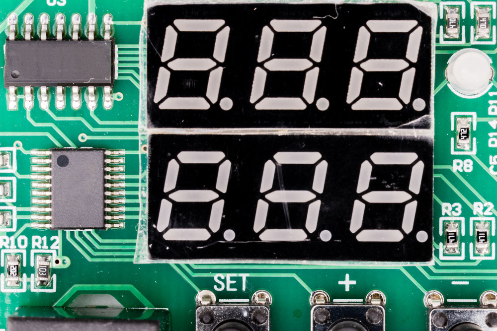 image of Seven-segment display (SSD), or indicator, an electronic display device for displaying decimal numerals. On green pcb with controller