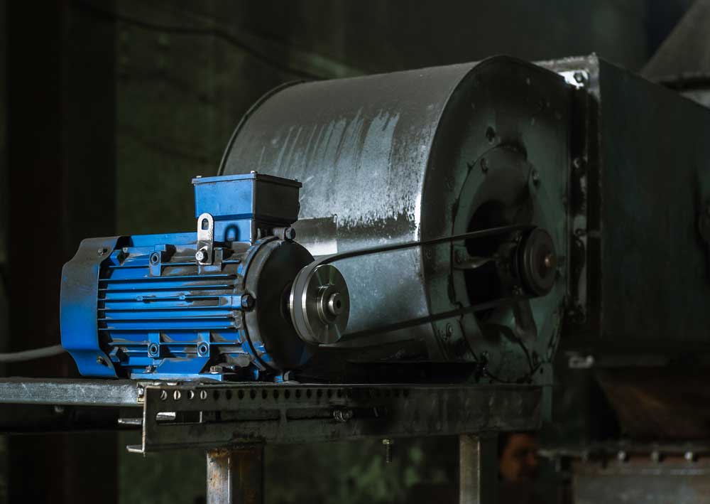 A large industrial motor along with a hydraulic pump