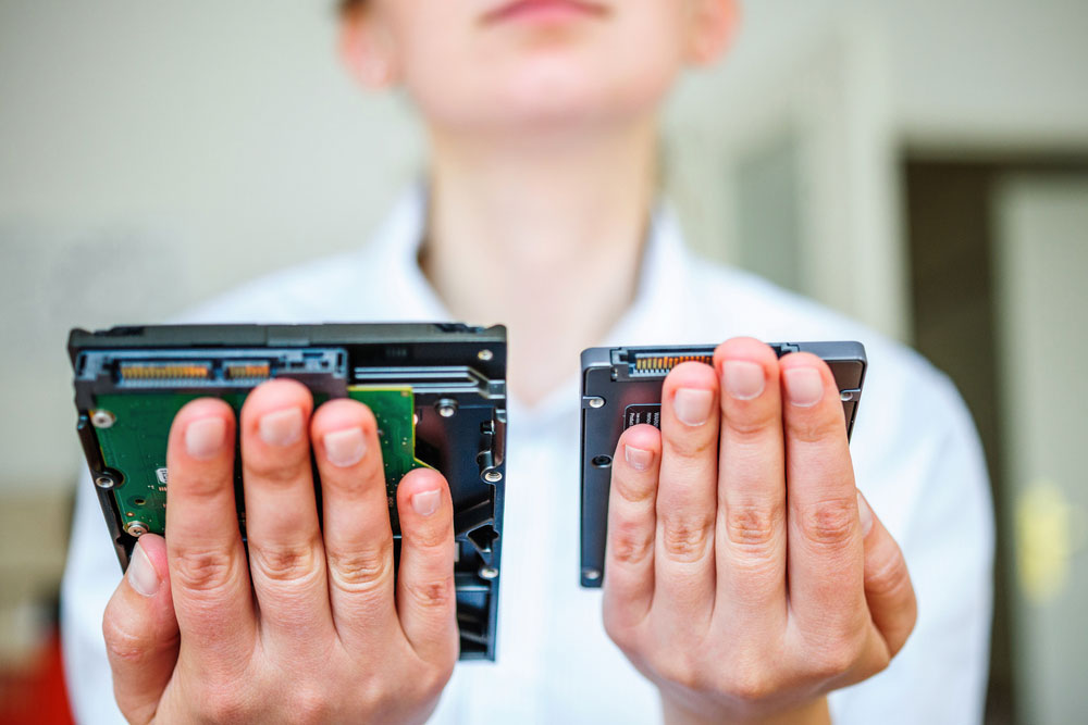 An HDD and SSD. Note the size difference