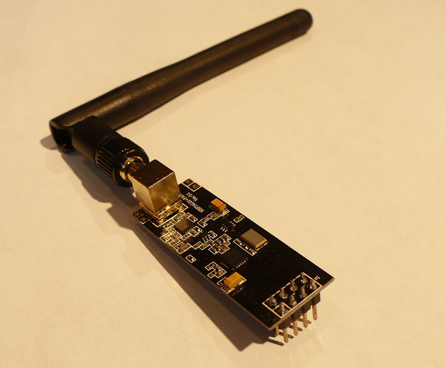 An nRF24L01 wireless module. Note the duck antenna is connected via the SMA connector.