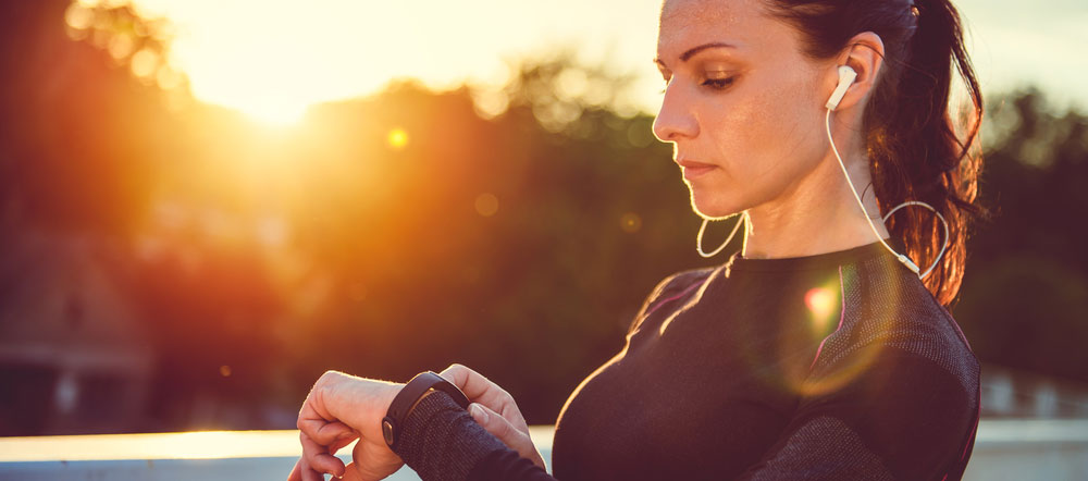 A woman with a fitness tracker