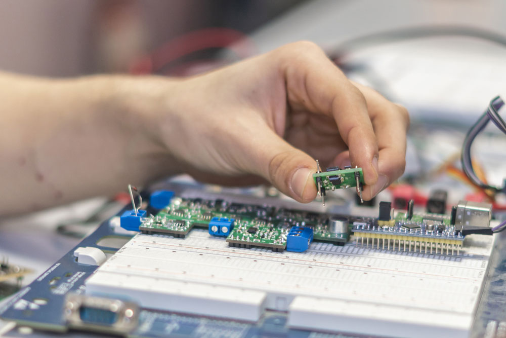 An engineer working on a circuit