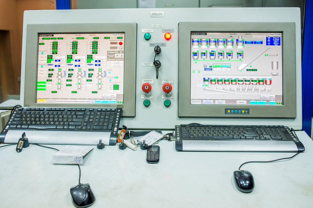 Factory control room with computers