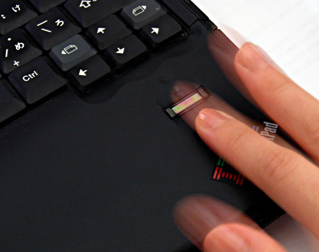 A Laptop PC Verifying a User by Fingerprint