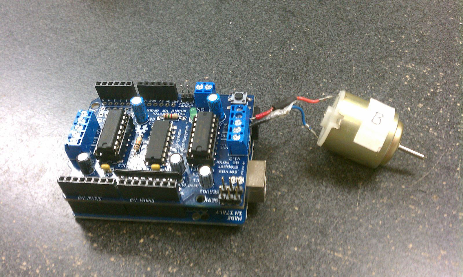 An Arduino motor shield with a 3V DC motor attached