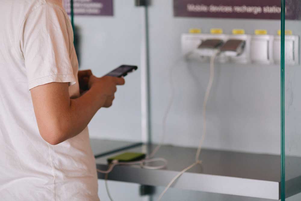 A man charging the phone with cable type C