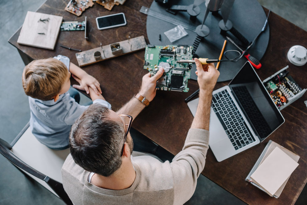 Father and son soldering