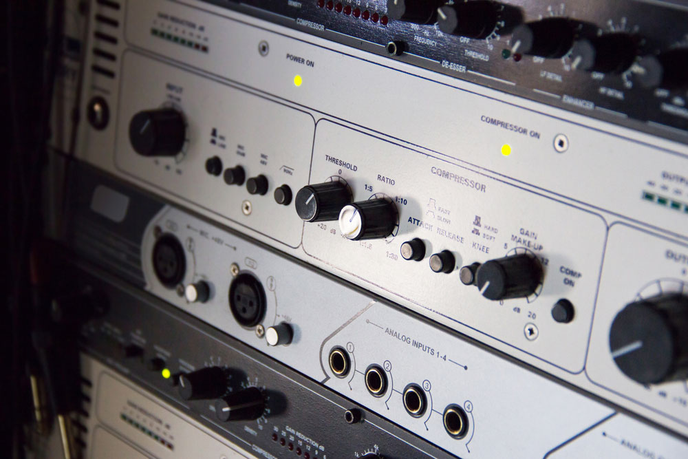 A rack of audio compressors