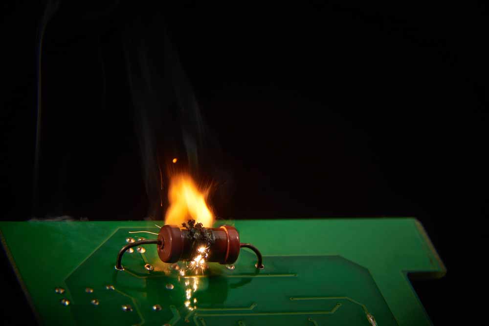 A shorted resistor burning while connected to a PCB