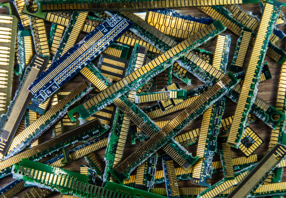 Industrial gold waste (gold fingers) from various circuit boards meant for recycling.