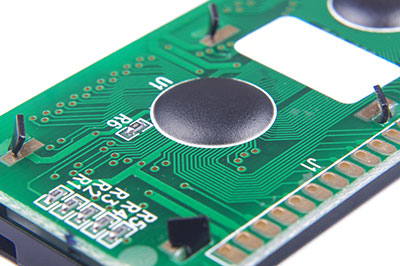 A typical PCB material with an adhesive spot of epoxy resin