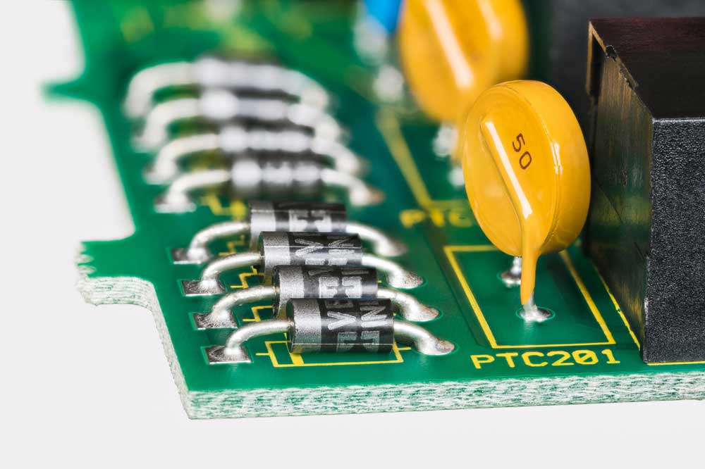 Through hole capacitors mounted on a PCB