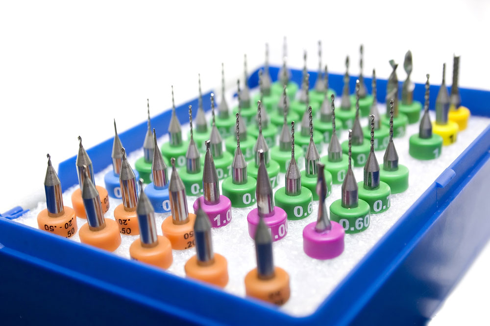 A collection of milling cutter drills with different diameter measurements