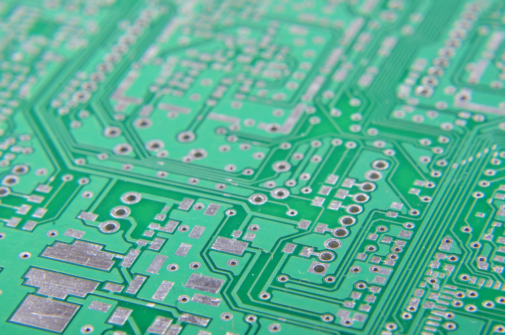 A large PCB showing different via apertures